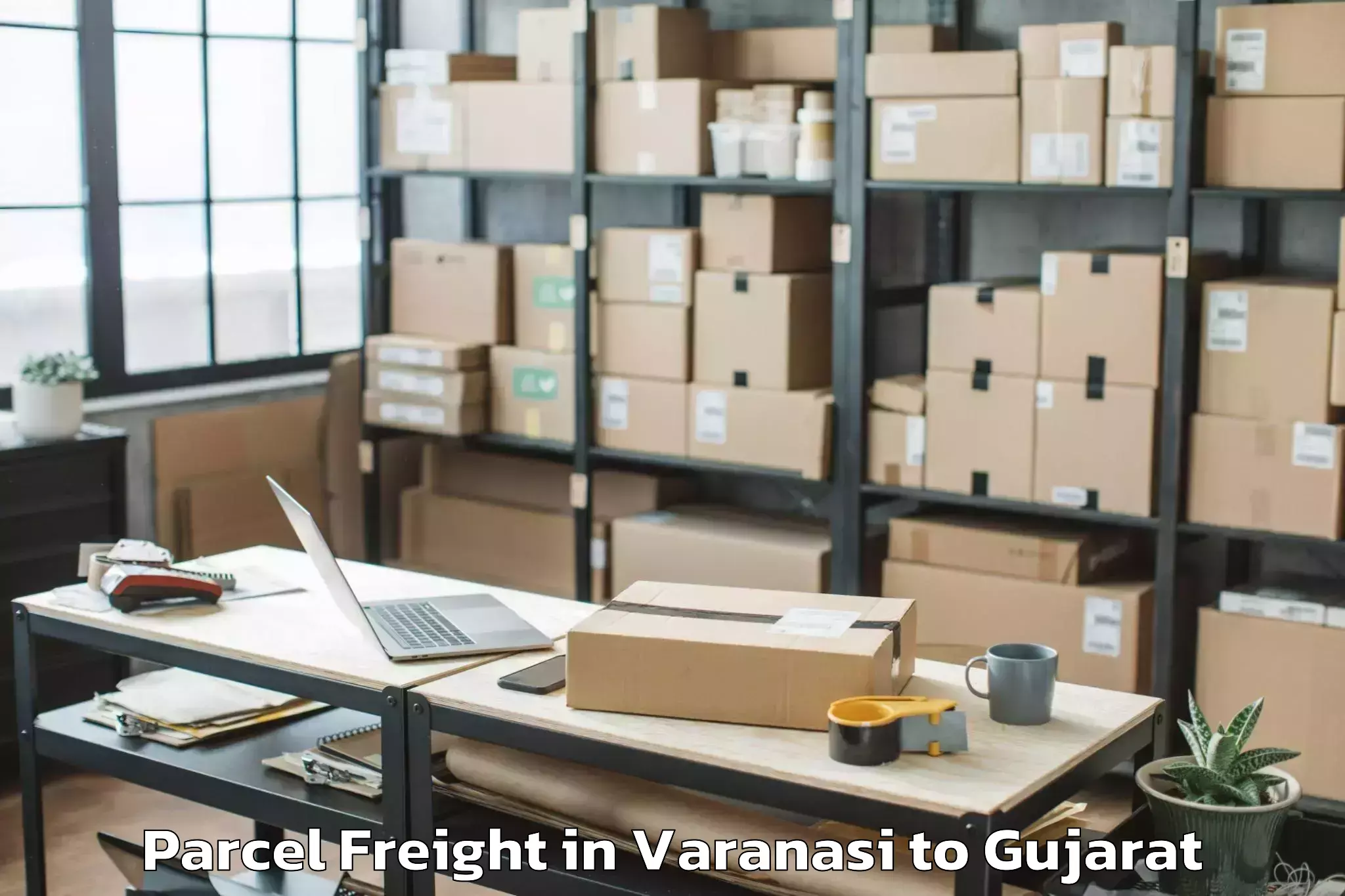 Book Varanasi to Jhulasan Parcel Freight Online